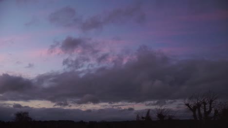 cumulus fluffy cloud moving fast across sky sunset time lapse low