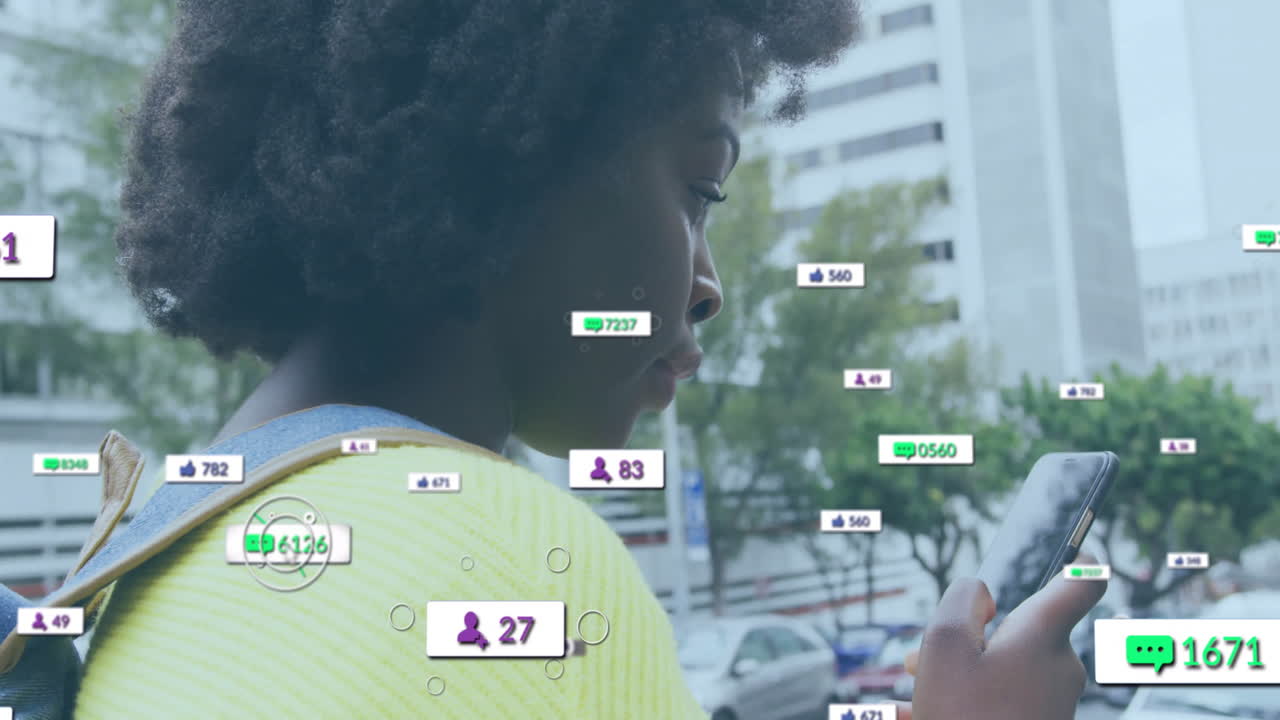 Animation of icons and data processing over african american woman using smartphone