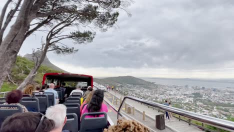 bus tour in cape town with tourists and panoramic cityscape view