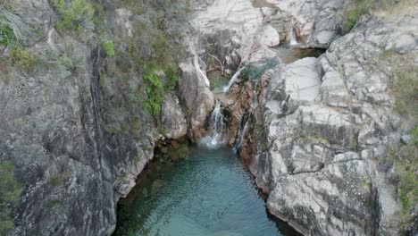 crystal clear water stream and natural pool, cascata da portela do homem, parque nacional peneda-gerês