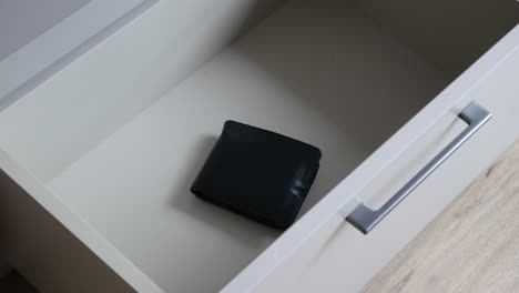 empty drawer with a wallet inside