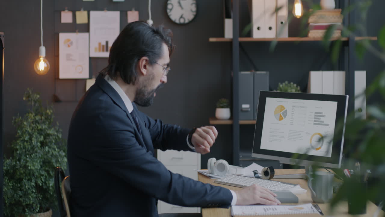 Businessman Stressed About Work in Office