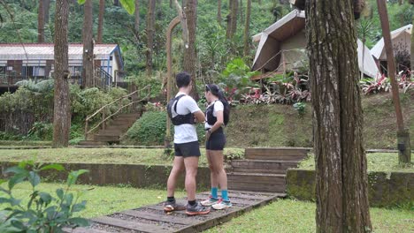 indonesian young adults using smartphone during trail run in forest
