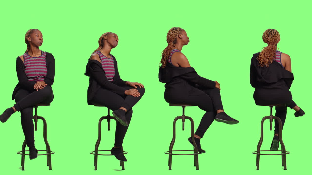 Woman Sitting on Stool Against Green Screen