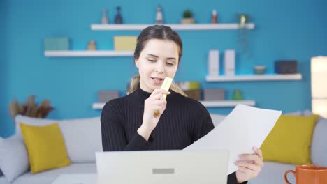 Young-entrepreneur-woman-working-in-home-office-at-facetime-business-meeting.