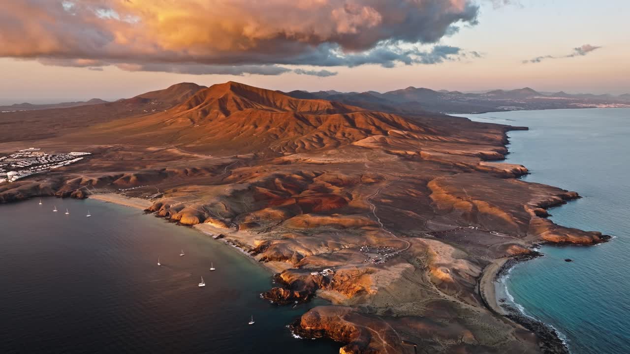 Stunning drone dlight over Lanzarote at sunset featuring Playa Mujeres and Playa Papagayo beaches.