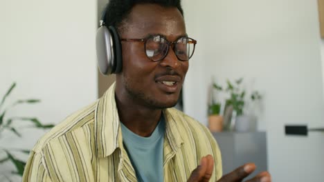 man listening to audio with headphones