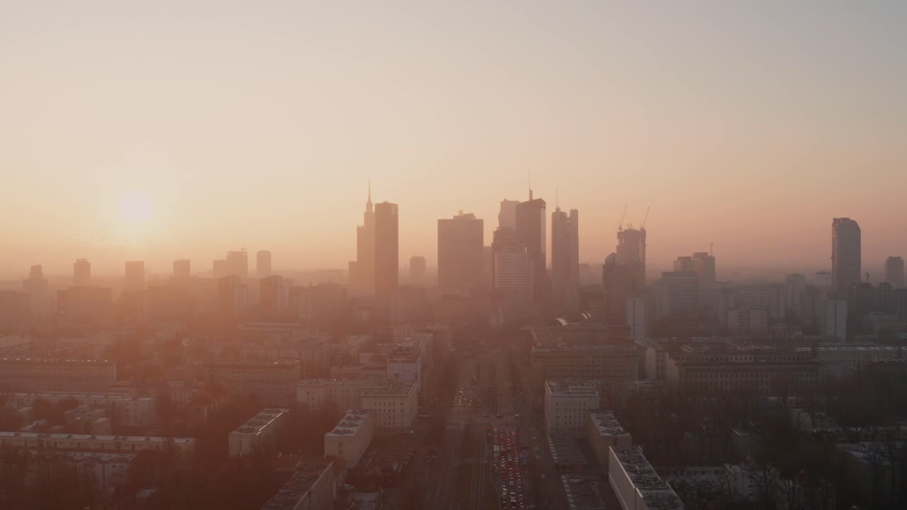 Morning flight over Warsaw. Sunrise and fog