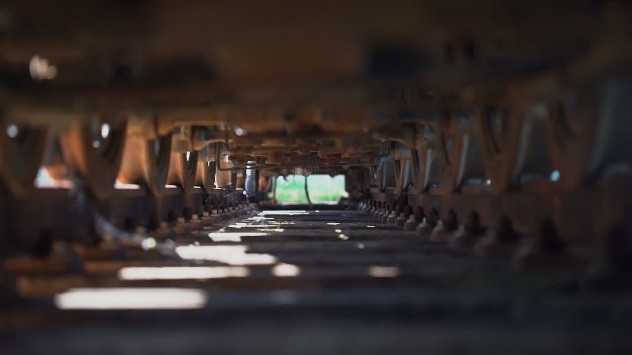 Underneath shot of a train on a railway track | Premium Stock Video Footage