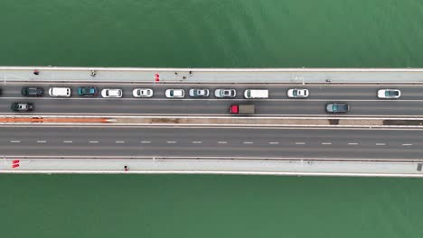 aerial view of the dongshuimen bridge in chongqing, china, with traffic flowing across multiple lanes. a snapshot of urban connectivity, showcasing infrastructure and the dynamic city life.