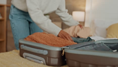 woman packing a suitcase