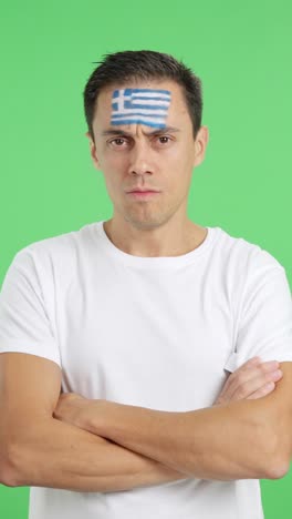 dignified and serious man with greek flag painted on face