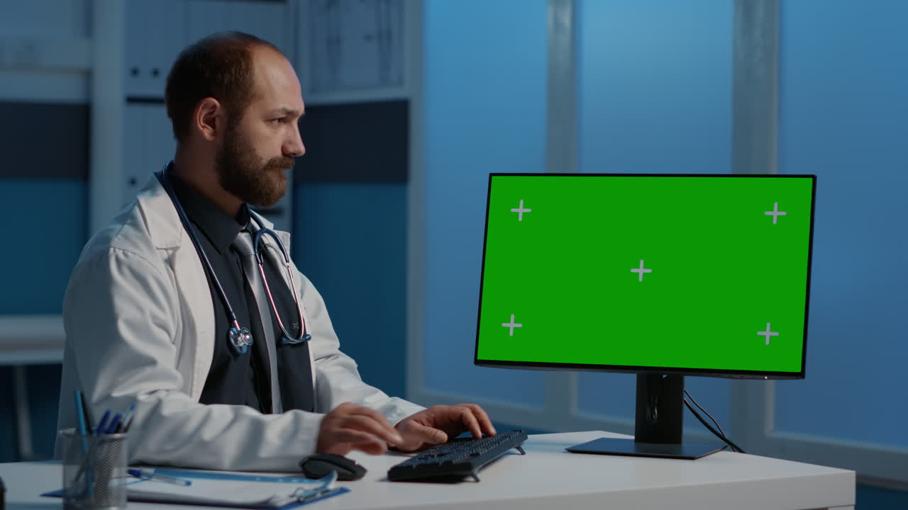 Doctor Using Computer with Green Screen