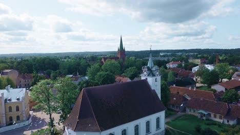 Aerial-view-over-an-old-church-in-Norway-with-birds-flying-on-wedding-day