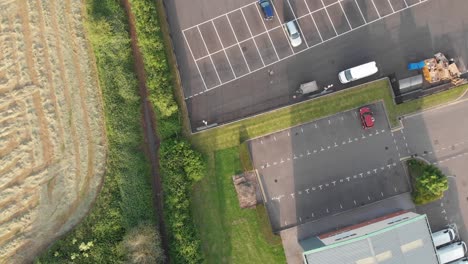 Twisting-drone-shot-of-a-car-park-in-england