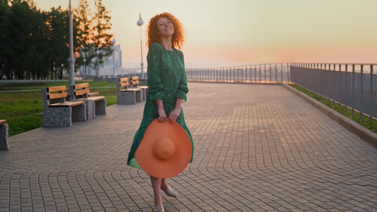 Woman in Green Dress at Sunrise Park
