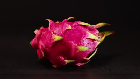 dragon fruit rotating on a dark background