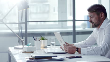 businessman in white shirt sitting in office