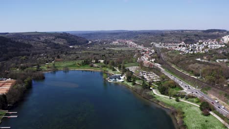 lake in french city with highway road