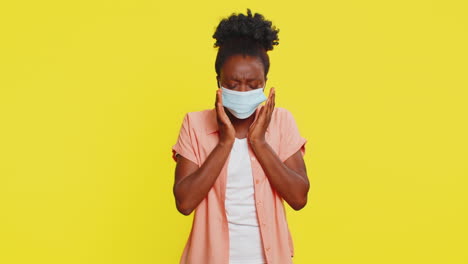 african american woman putting on medical mask tired expression covering nose and mouth health focus