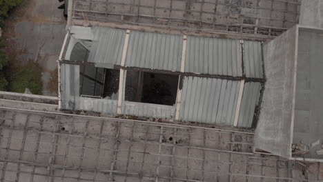 flight over the destroyed roof of the demolished and abandoned hotel