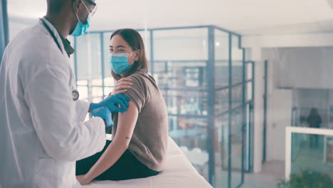 doctor administering a vaccine to a patient