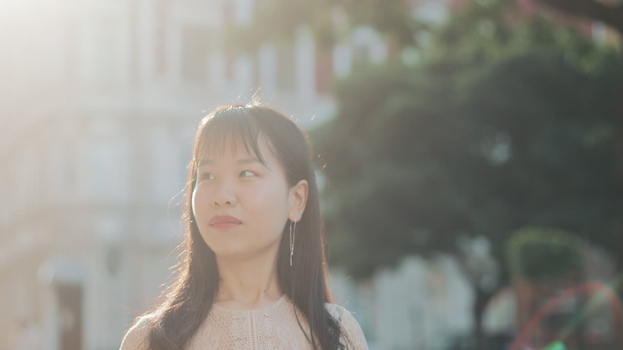 Asian woman using mobile phone in the city