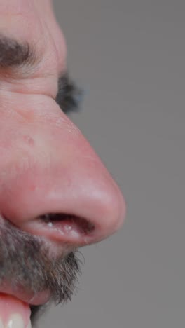 close-up of man speaking into microphone