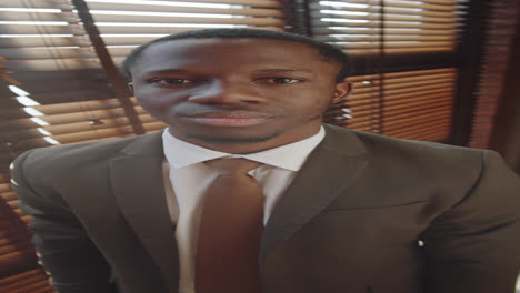 portrait of young black businessman in formal suit