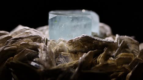 a very tight macro shot of a rare aquamarine sample nested in muscovite from argentina