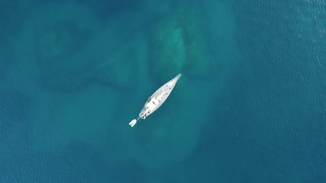 top down footage of yacht anchored in the caribbean sea