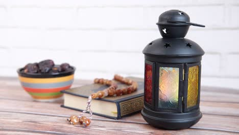 ramadan celebration with dates, quran, and lantern