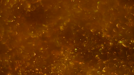abstract gold background with chaotical motion of bubbles. balls rotation, abstract molecular brownian motion.