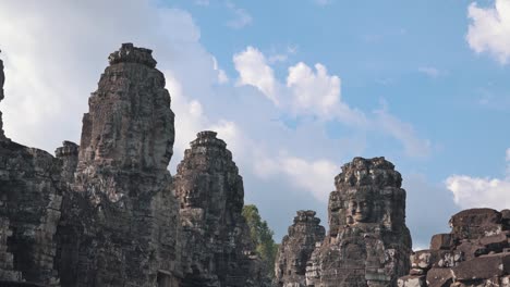 medium timeplase of the bayon temple faces near angkor wat