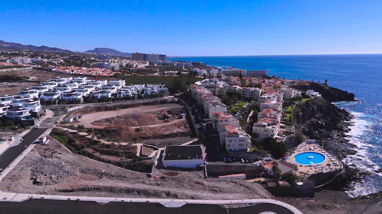 Playa san juan, tenerife, with coastal development and the ocean, aerial view