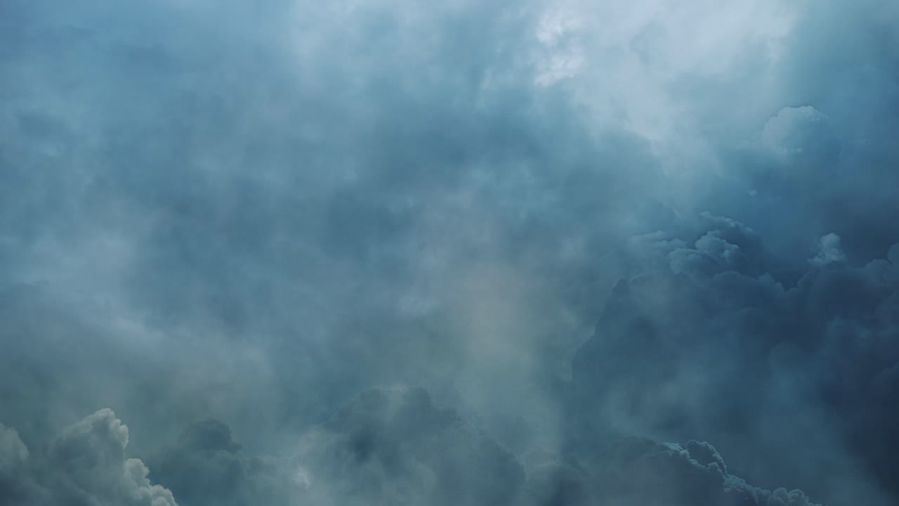 cinematic thick clouds in dark sky and thunderstorm