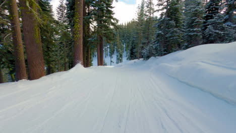 pov shot of a snowboarder riding through a ski resort