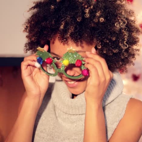 fun vivacious young woman celebrating christmas