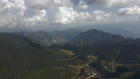 Small-village-in-nature-valley-panoramic-landscape,-aerial-Huasteca-Potosina