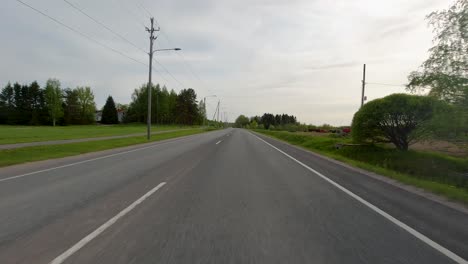 Travelling-on-a-quiet-country-road-outside-the-city-of-Porvoo,-Finland