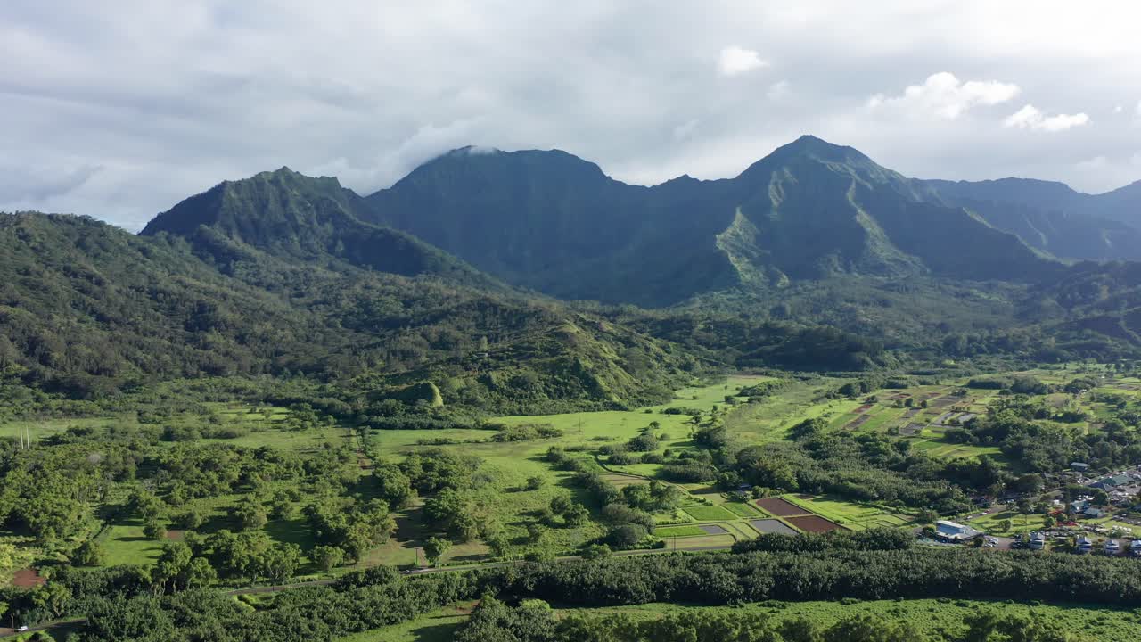 Descending dolly aerial shot of the rugged mountains of Kaua'i, Hawai'i