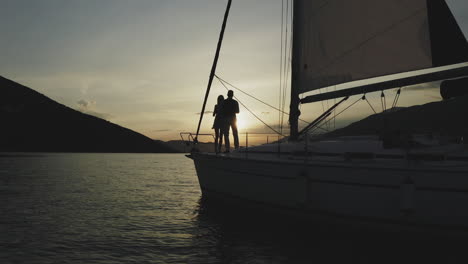 couple enjoying a sunset on a yacht