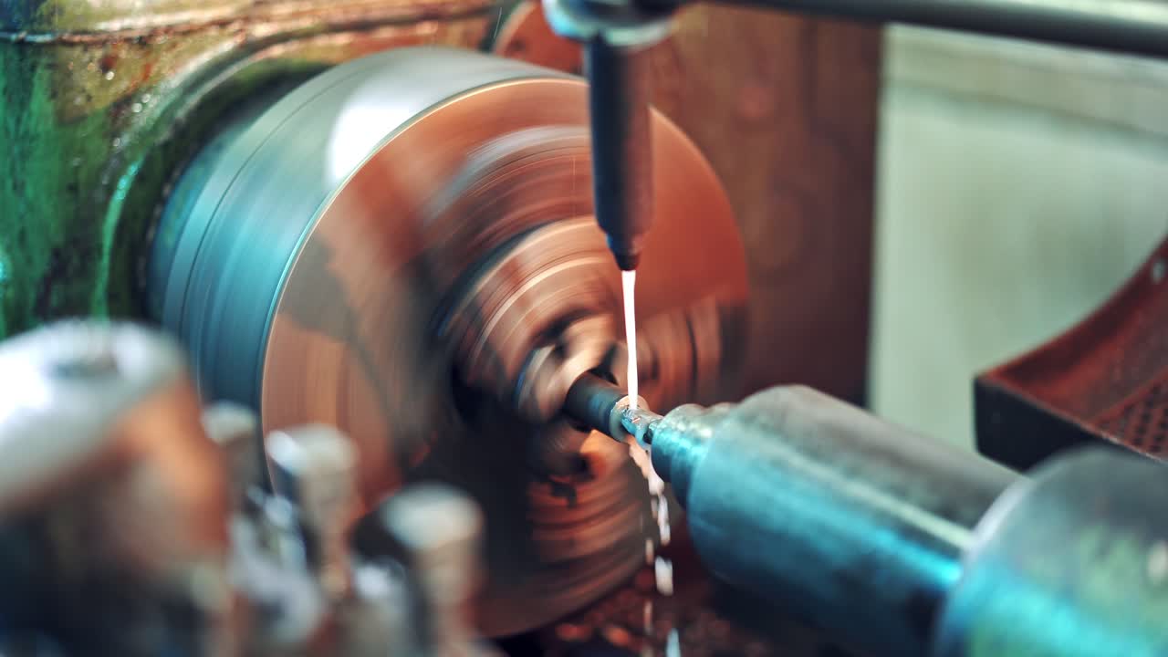 CNC milling machine in process on a factory. Metal working machine with cutter tool during turbine aluminium detail milling. Close-up