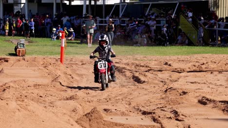 motocross rider navigating a sandy track