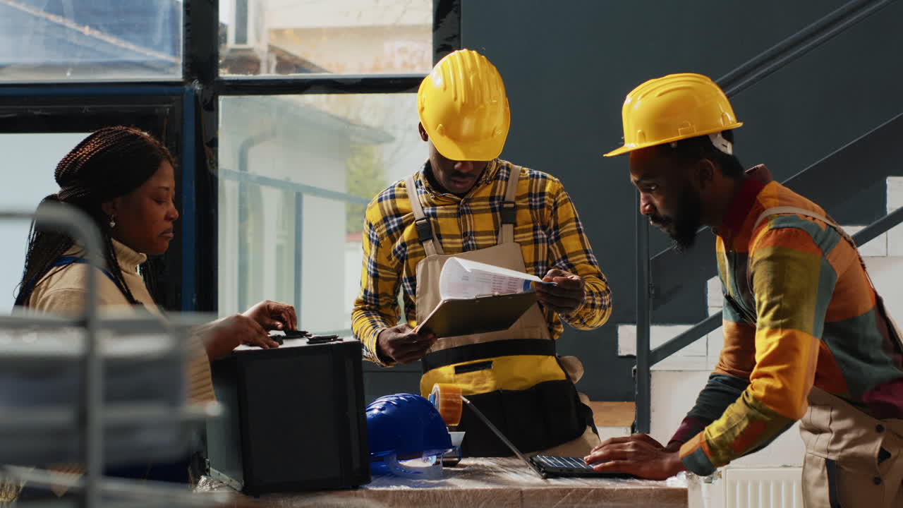 Construction Workers Discussing Plans