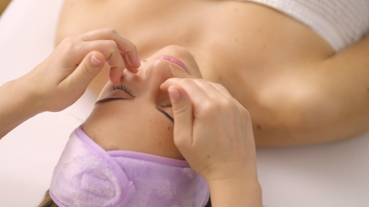 Woman receiving a face massage at a spa