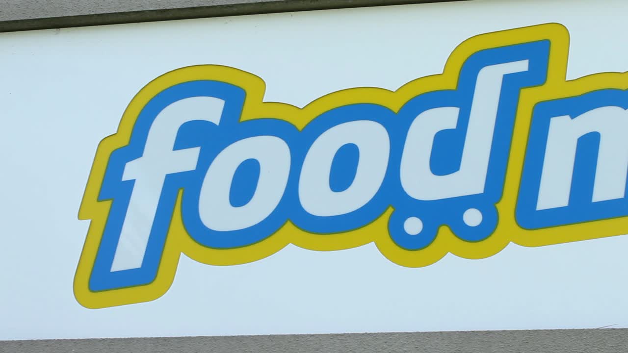 A close-up view of the Food Maxx supermarket sign