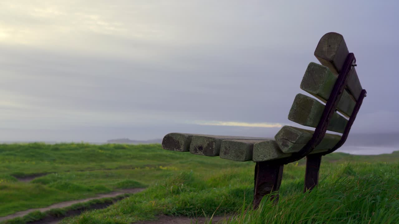 wooden bench at the beach, half moon bay