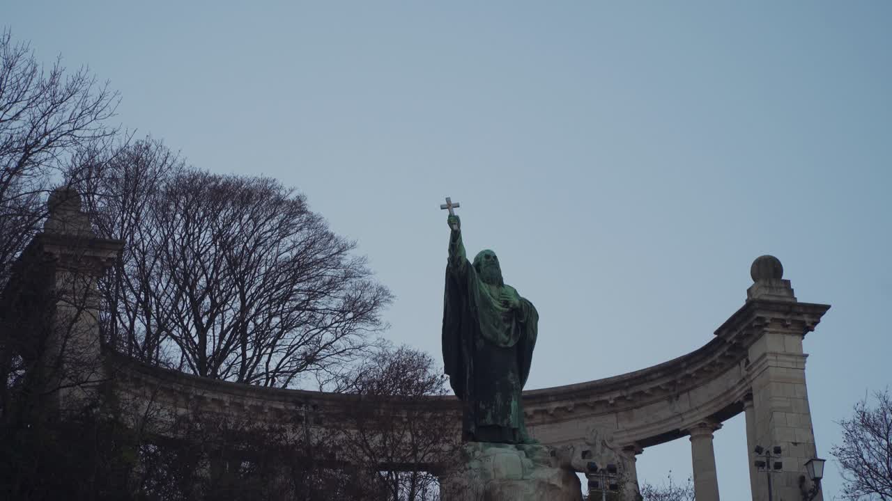 Saint Gellert Monument At The Gellert Hill In Budapest Hungary With Bare Trees And Antique Columns In The Background - Tilt Down Pan Shot