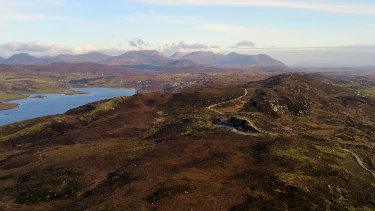 Aerial perspective of the vast Clifden landscape with the Twelve Bens in the background.